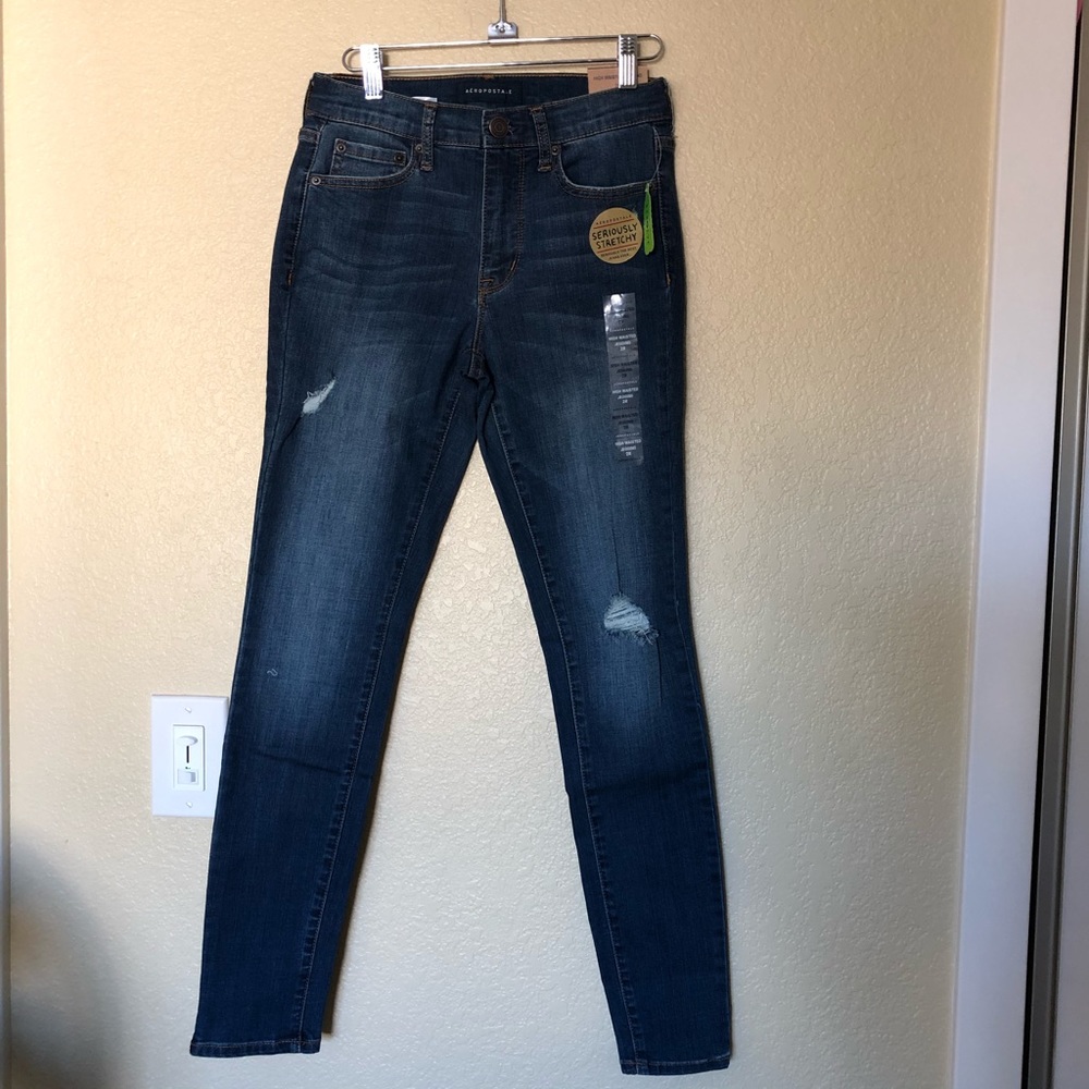 High waisted distressed dark rinse denim